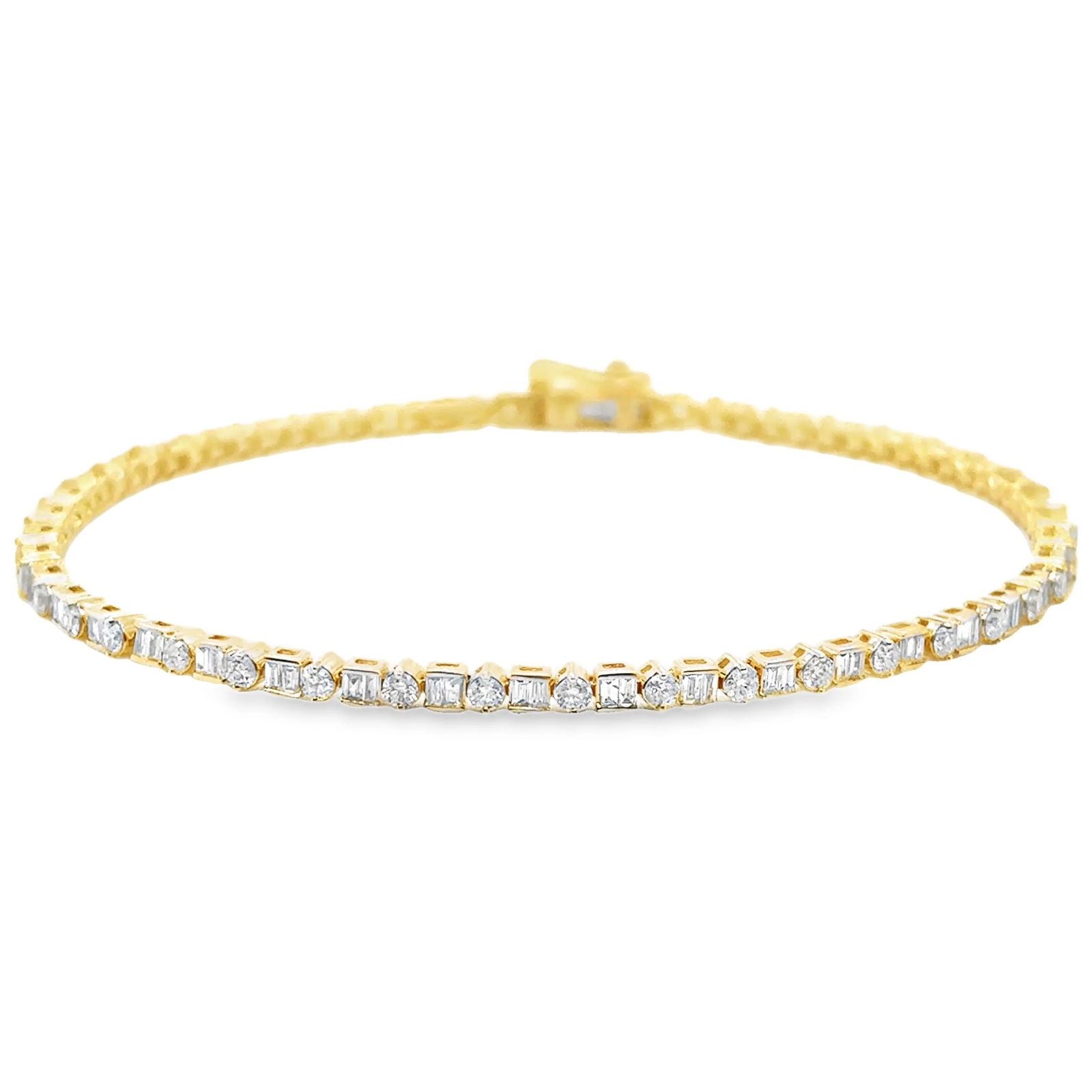 14KT YELLOW GOLD DIAMOND AND BAGUETTE DIAMONDS TENNIS BRACELET: 14KT YELLOW GOLD DIAMOND AND BAGUETTE DIAMONDS TENNIS BRACELET 7.5"14KT GOLD WT. APPROX. 7.02 GRAMDIAMOND WT. APPROX. 1.78 CARAT LENGTH: 7.5 INCHES LONGSIZE APPROX. - 2.5 MM WIDE