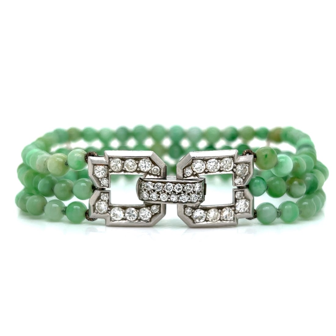 Art Deco Platinum Jade & Diamond Bracelet: Art Deco Platinum Jade & Diamond BraceletWeighing 23.1 gramsSet with 38 European-cut Diamonds weighing app. 2.20 Ct.F-G Color, VVS-VS Clarity7.25 inches in length