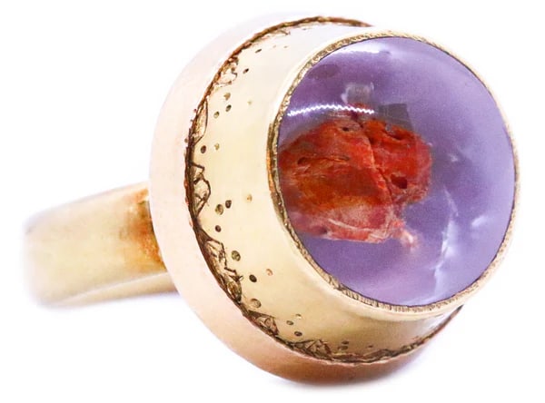 FALK BURGER GOLDSMITH 18 KT GOLD MASSIVE RING WITH DESERT FOSSIL: VERY UNUSUAL RING DESIGNED BY THE SANTA FE GOLDSMITH ARTIST FALK BURGER. REALIZED IN SOLID 18 KARAT OXIDIZED ORANGE YELLOW GOLD, THIS RING IS FEATURING A SMALL FOSSILIZED DESERT INSECT FLOATING IN THE