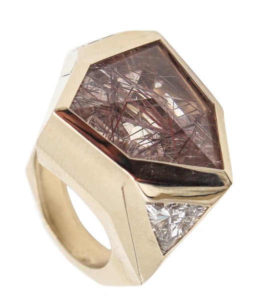 KAVERAS Geometric Cocktail Ring In 18Kt Gold With Diamonds & Rutile Quartz: A sculptural geometric cocktail ring designed by Kaveras.This is a magnificent sculptural ring created in New York City by the Korean designer Kaveras. This contemporary ring has been masterfully craf