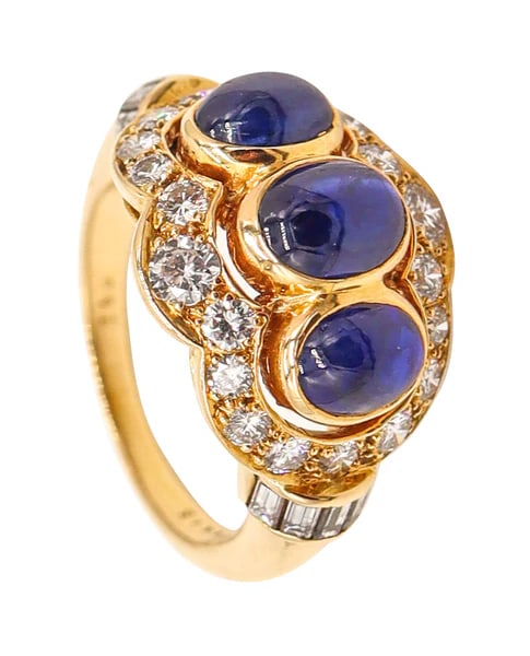 CARTIER Paris Cocktail Ring In 18Kt Yellow Gold With 3.73 Ctw Sapphires & Diamonds: Sapphires cocktail ring designed by Cartier.This is a beautiful vintage cocktail ring created in Paris France by the jewelry house of Cartier, back in the late 1970's. The cocktail ring has been maste
