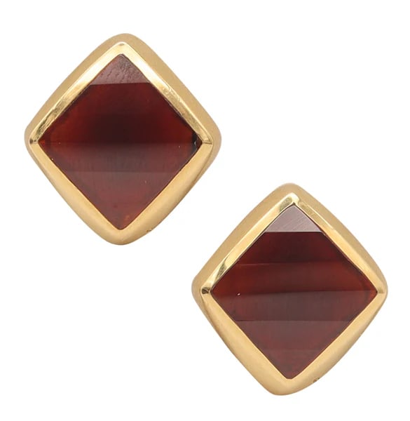POMELLATO Clips-On Earrings In 18Kt Yellow Gold With Faceted Red Garnets: Geometric cocktail ring designed by Pomellato.This is a beautiful pair of clips-on earrings created in Milano Italy by the jewelry house of Pomellato. These vintage earrings have been crafted in solid