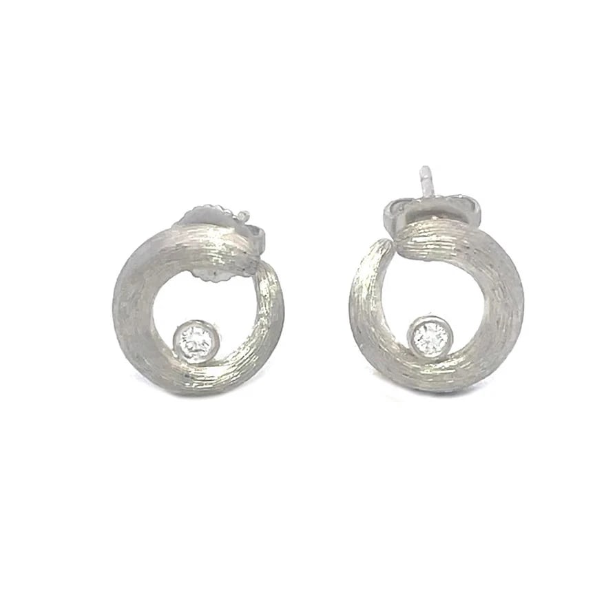 Henry Dunay Diamond Earrings Platinum Open Circle Stud Style: The Henry Dunay Diamond Platinum Earrings are a stunning piece of fine jewelry featuring a brush textured finish open circle design in platinum, each circle is accented with a bezel set natural white