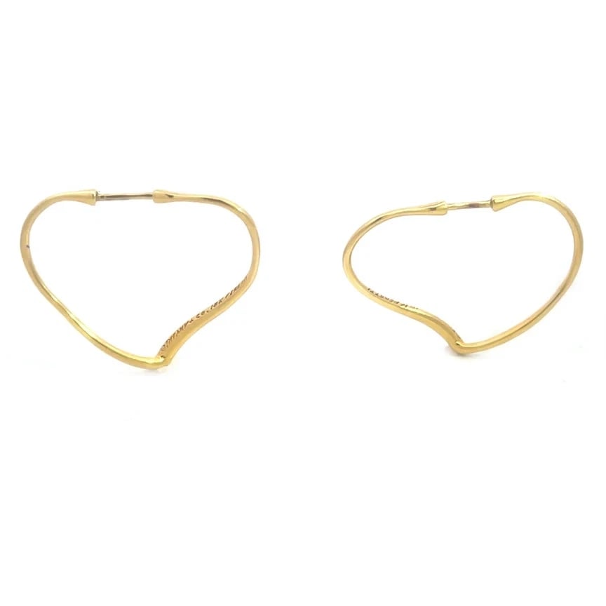 Tiffany & Co. Peretti Gold Hoop Earrings 18k Yellow Open Heart Dangle Style: The product is a pair of Tiffany & Co. Peretti Gold Hoop Earrings in 18k yellow gold from her Open Heart Collection, it is in a dangle style. These earrings are signed by Tiffany & Co. and feature a