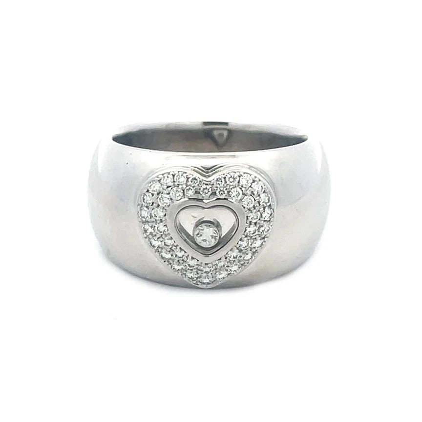 70985 Chopard Happy Diamond Gold Ring 18k White Heart Wide Dome Band: This lovely Chopard dome band diamond ring is a charming piece of fine jewelry featuring pave diamond set heart-shaped frame set in 18k white gold on the front of the wide polished dome band, the cent