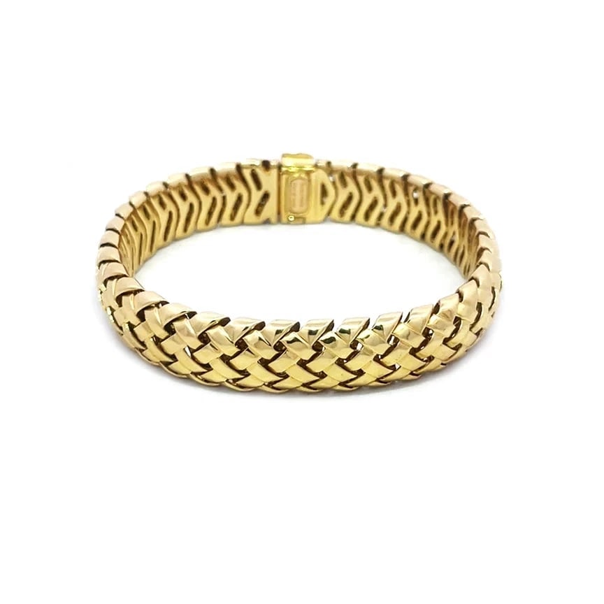 Tiffany & Co. Vannerie Gold Bracelet 18k Yellow Woven Style Flex Links Box: The product is a vintage Tiffany & Co. Vannerie Gold Bracelet from the 1990s, featuring an intricate woven design with flex links. Made of 18k yellow gold, this bracelet is signed by Tiffany & Co.