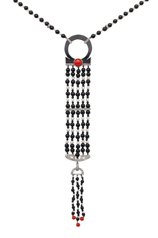 ART DECO 1925 Long Sautoir In Platinum With Diamonds Pearls Coral & Onyx: A French art-Deco sautoir necklaceThis is a fabulous long sautoir necklace created in France during the art-deco period, circa 1925. This colorful piece is the epitome of the French art-deco design an