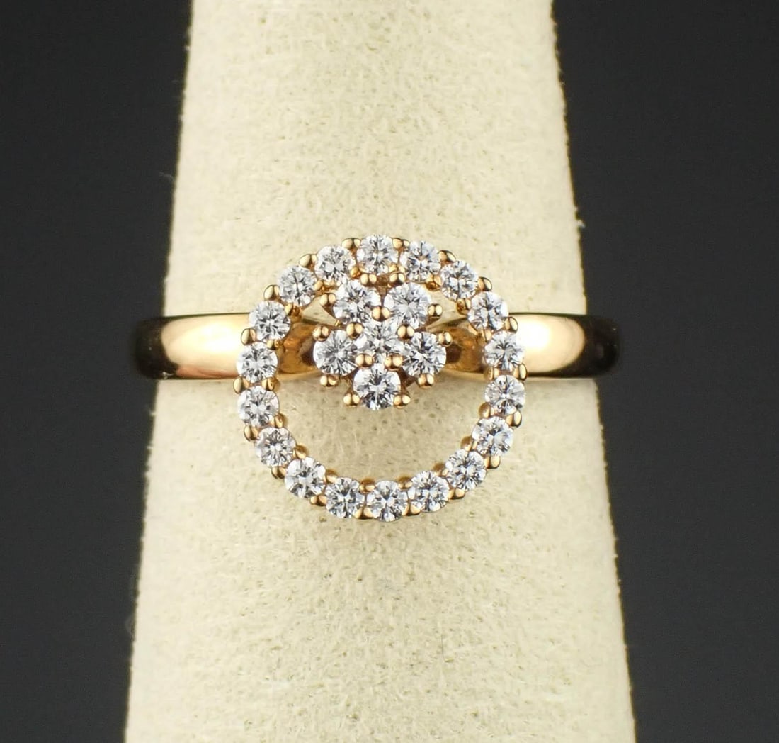 NORMAN TEUFEL: DIAMOND & 14K GOLD RING: NORMAN TEUFEL: DIAMOND & 14K GOLD RING:vintage yellow gold kinetic (spinning) ring set with 24 round-cut diamonds weighing approximately 0.25 cttw. The ring weighs 3.5 grams and is stamped "14K", "198
