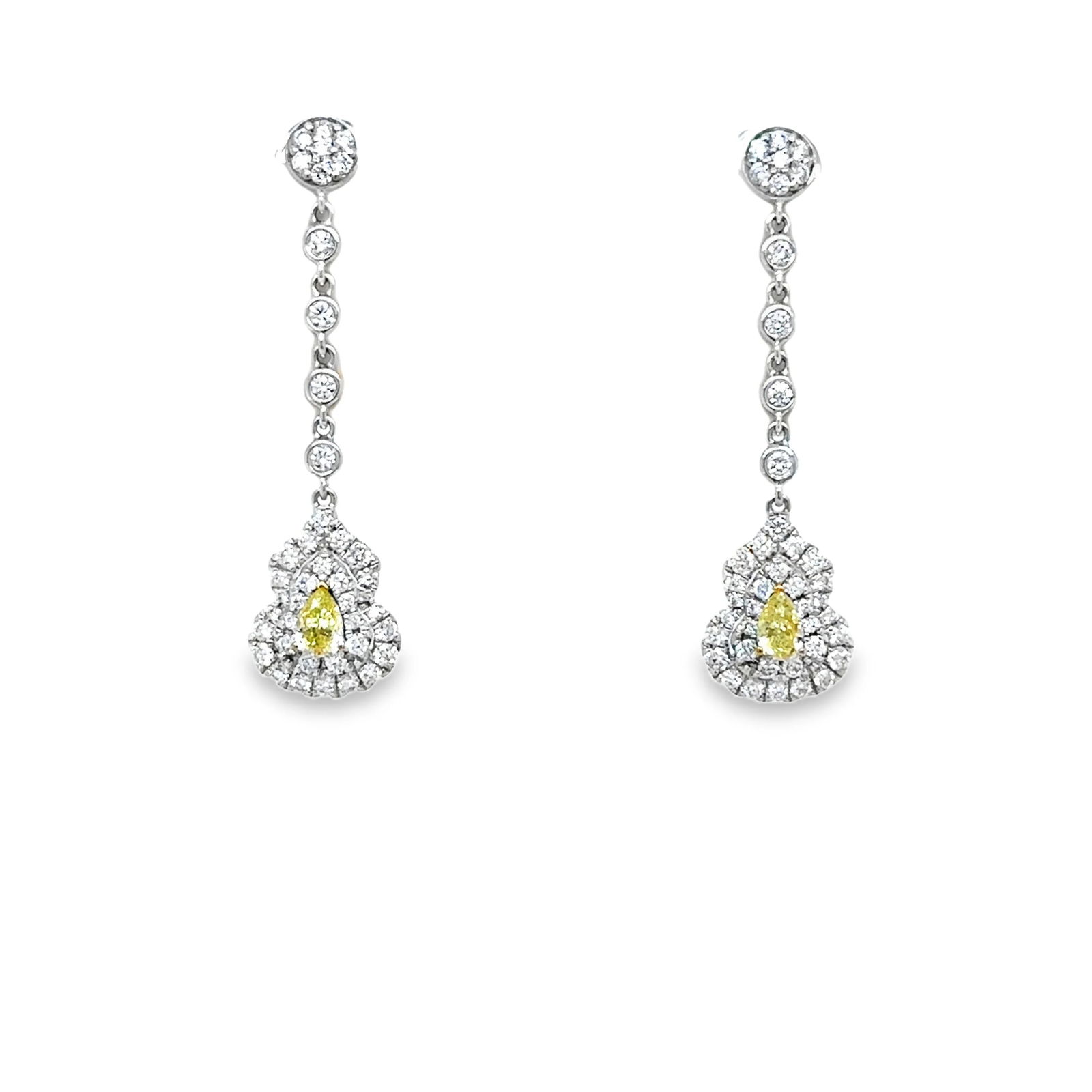 18KT WHITE GOLD DIAMOND AND YELLOW DIAMOND EARRING: 18KT WHITE GOLD DIAMOND EARRING18KT GOLD WT. APPROX. 3.44GRAMDIAMOND WT. APPROX. 0.67CARAT YELLOW DIAMOND WT. APPROX. 0.29 CARAT SIZE APPROX. APPOX. 9 X 35 MM