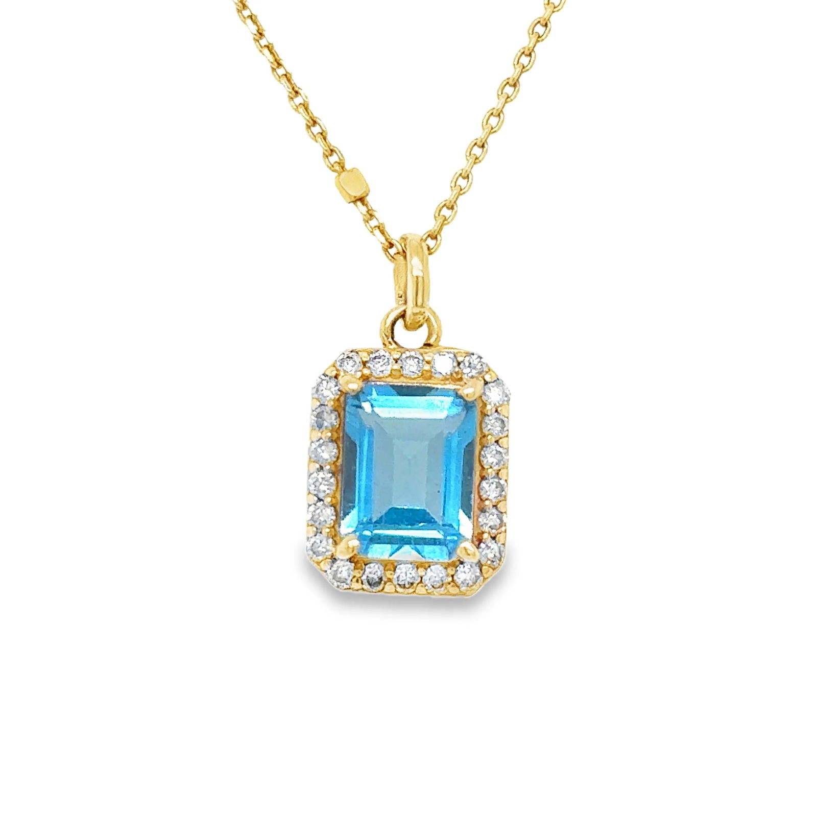 14KT YELLOW GOLD PENDANT WITH DIAMONDS AND BLUE TOPAZ: 14KT YELLOW GOLD PENDANT WITH DIAMONDS AND BLUE TOPAZ14KT GOLD WT. APPROX. 1.20 GRAMDIAMOND WT. APPROX. 0.26 CTS/ 7 PCSBLUE TOPAZ WT. APPROX. 1.76 CTS/ 01 PCPENDANT SIZE APPROX. 9.5 MM X 11 MM