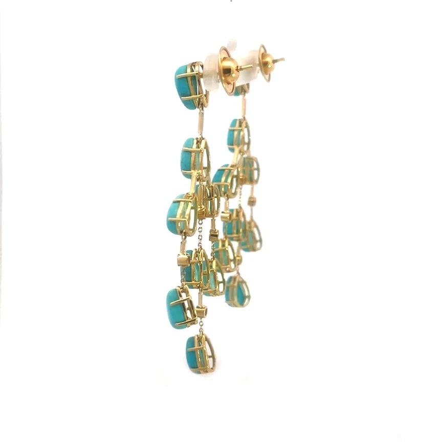 Turquoise Gold Chandelier Earrings Diamond 18k Yellow Dangle Style: The product is a pair of vintage 18k yellow gold chandelier earrings featuring prong set pear shape turquoise gemstones in a dangling triangle shape chandelier style with diamond accents. The earrings