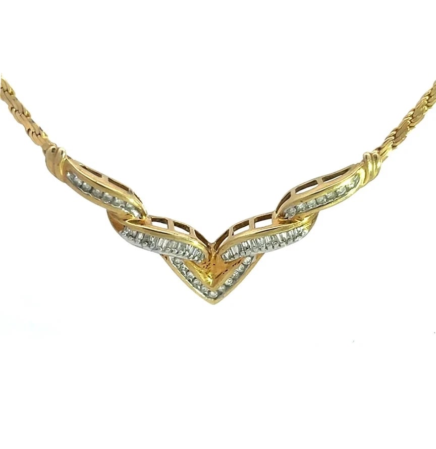 Diamond Gold V Pendant Necklace 14k Yellow Herring Bone Chain: This beautiful diamond and gold necklace features a classic 14k yellow gold chain with a wide V-shaped pendant attached to the pendant which has baguette and round cut channel-set natural white diamon