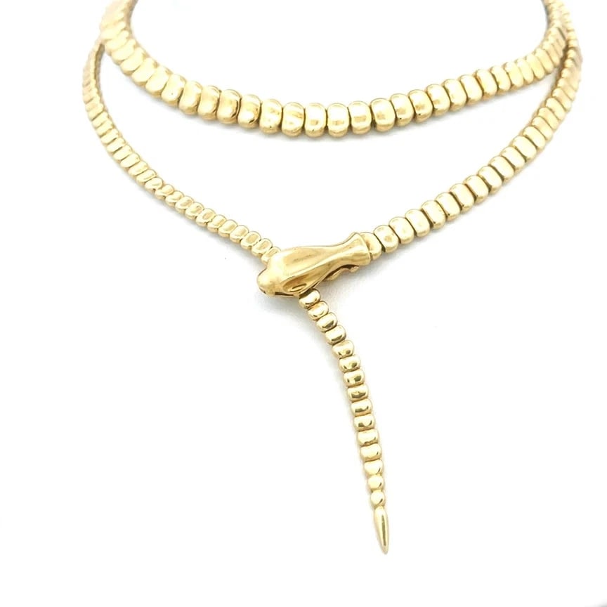 7305 Tiffany & Co Peretti Gold Snake Lariat Necklace 18k Yellow Adjustable Style: This gorgeous necklace is from Tiffany & Co, by designer Elsa Peretti from her Snake Collection. It is crafted from 18k yellow gold with a polished finish. From the polished snake's head to its pointe