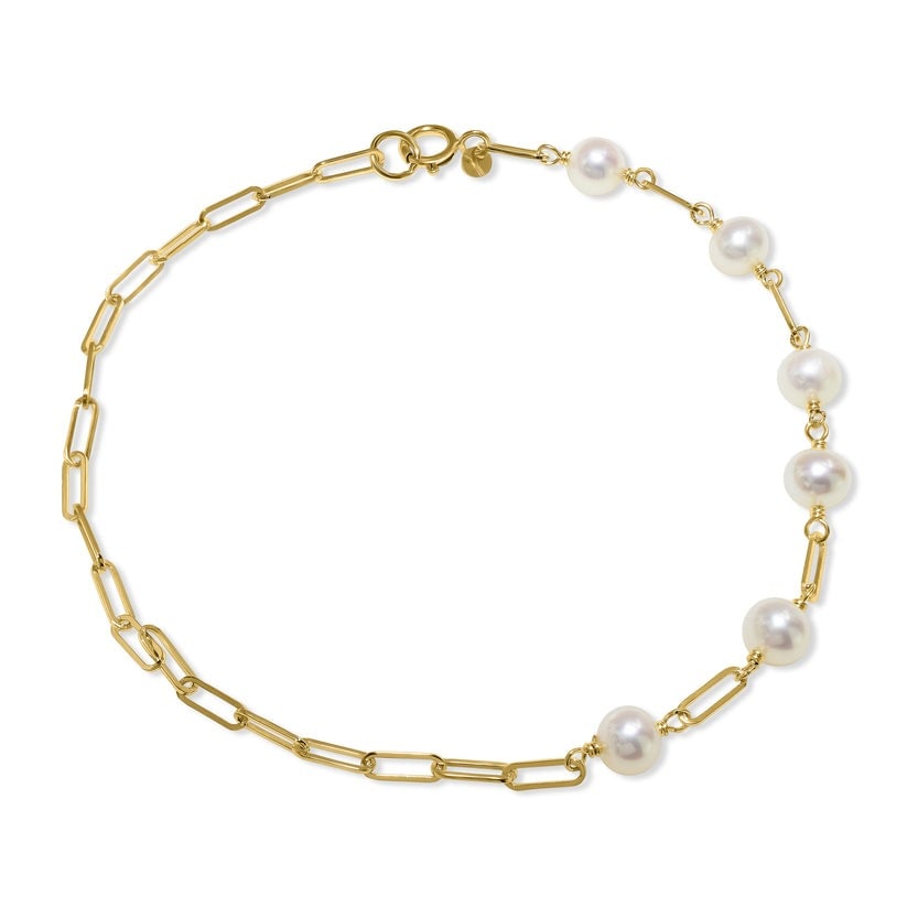 14k White Pearl Paperclip Bracelet: Indulge in elegance with our 14k White Pearl Paperclip Bracelet. Made from high-quality 14k gold, this sleek and modern bracelet features stunning white pearls that add a touch of sophistication to an