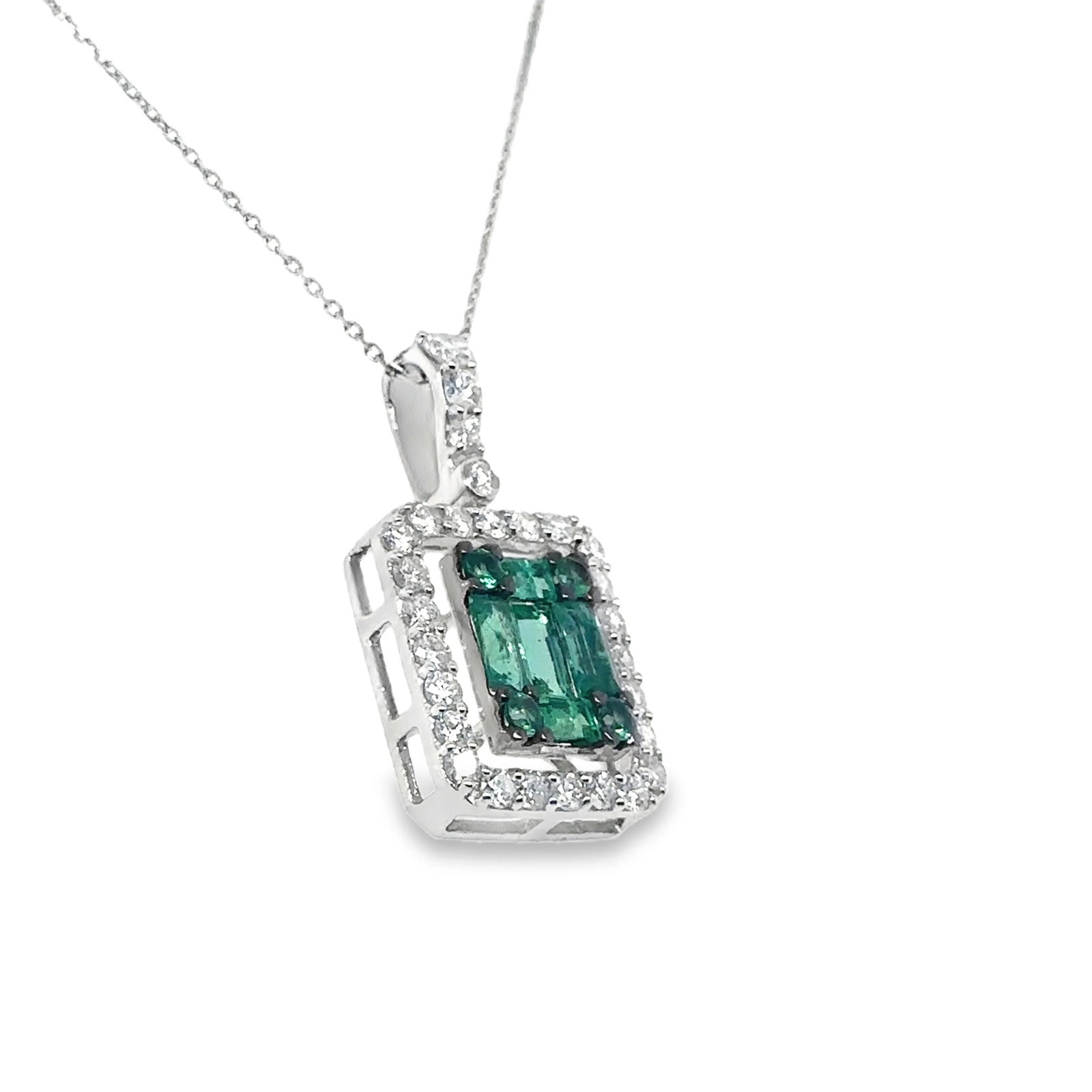 18KT GOLD EMERALD AND DIAMOND PENDANT: 18KT GOLD EMERALD AND DIAMOND PENDANT18KT. GOLD WT. APPROX. 2.41 GRAMDIAMOND WT. APPROX. 0.59 CTS / 28 PCSEMERALD WT. APPROX. 0.76 CTS / 9 PCS SIZE: 12 X 22 MM PRICE IS ONLY FOR PENDANT WITHOUT A