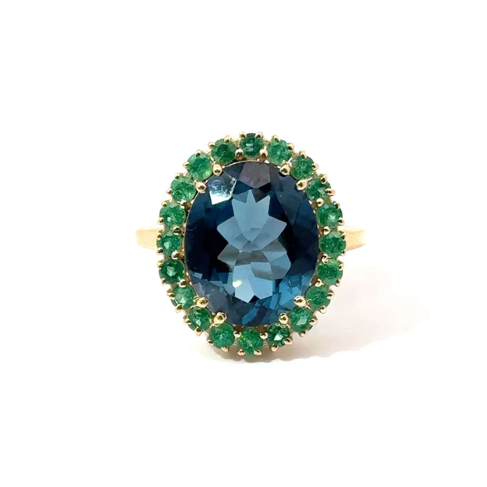 14KT YELLOW GOLD TOPAZ AND EMERALD RING: 14KT YELLOW GOLD LONDON BLUE TOPAZ AND EMERALD RING14KT GOLD WT. APPROX. 4.18 GRAMLONDON BLUE TOPAZ WT. APPROX. 6.90 CARATEMERALD WT. APPROX. 0.70 CARAT / 22 PCS
