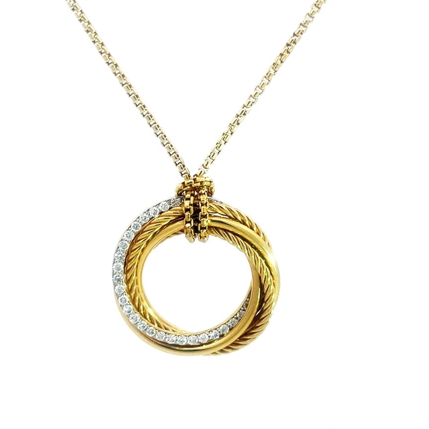 David Yurman Gold Pendant Diamond 18k Yellow Pave Set Circle w/Chain: The David Yurman Gold Crossover Pendant is a stunning piece of fine jewelry featuring 3 polished and 2 cable ring as the pendant set in a crossover style, one polished ring is set with natural pave se