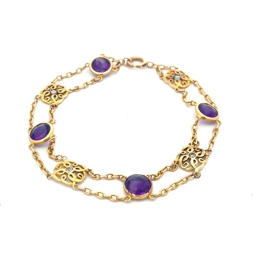 Victorian Amethyst Gold Bracelet Diamond 16k Yellow Floral Motifs Chain: This Victorian Amethyst Gold Bracelet features 4 stunning round amethyst set in 16k yellow gold with diamond and opal accents. The intricate floral motifs set between the double oval link chain add a