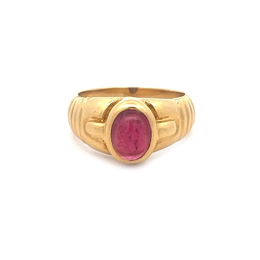 Bulgari Tourmaline Gold Ring Parentesti 18k Yellow Solitaire: Elegant and authentic from Bvlgari from the Parentesi Collection, this ring is crafted from 18k yellow gold with an oval cabochon pin tourmaline gemstone in bezel mount with the design on the top of e