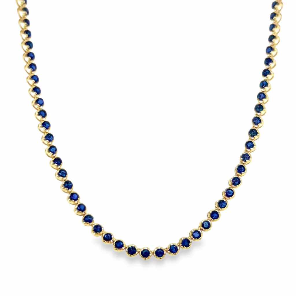 14KT GOLD BLUE SAPPHIRE TENNIS NECKLACE: 14KT GOLD BLUE SAPPHIRE BUTTERCUP TENNIS NECKLACE14KT GOLD WT. APPROX. 18.45 GRAMBLUE SAPPHIRE WT. APPROX. 10.84 CARAT/ 120 PCSLENGTH: 18 INCHES LONG