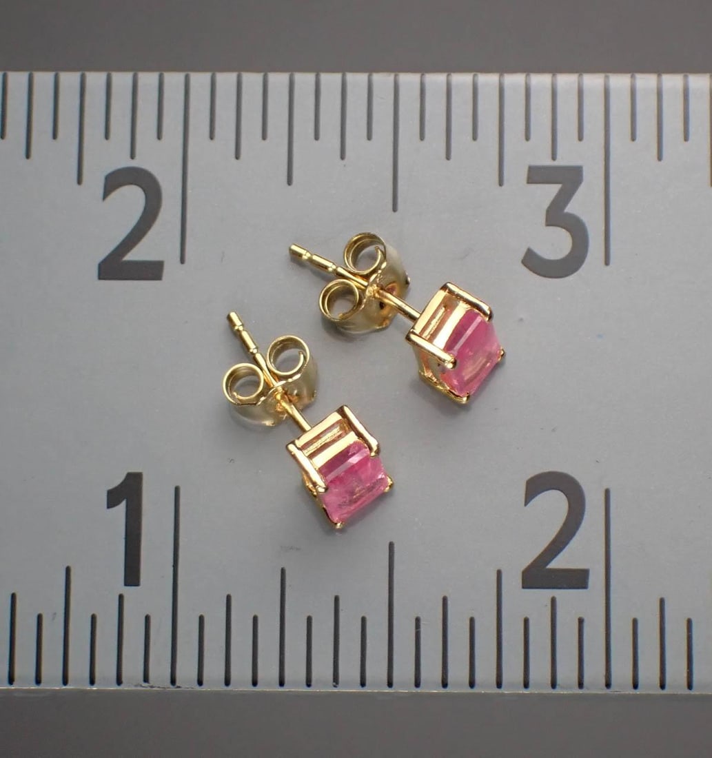 PAIR OF PINK SAPPHIRE & 14K GOLD EAR STUDS: PAIR OF PINK SAPPHIRE & 14K GOLD EAR STUDS:prong set with a pair of emerald-cut pink sapphires weighing approximately 1.75 cttw. The yellow gold ear studs weigh 1.1 grams, with each gold post stamped 