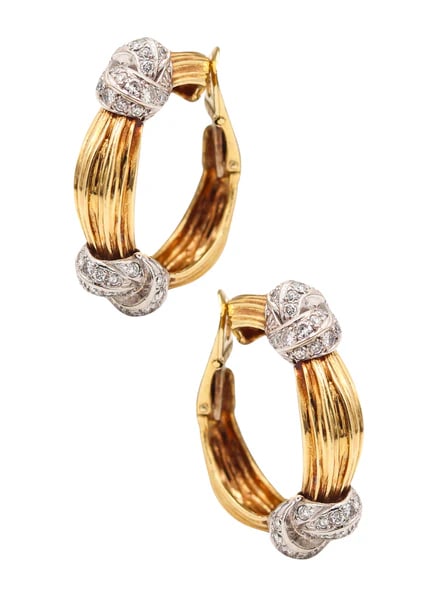 Pair of hoops earrings designed by Kutchinsky.This is a fantastic pair of hoop-earrings, created in: Pair of hoops earrings designed by Kutchinsky.This is a fantastic pair of hoop-earrings, created in London England by the jewelry house of Kutchinsky, back 1974. The pair was made-up with great crafts