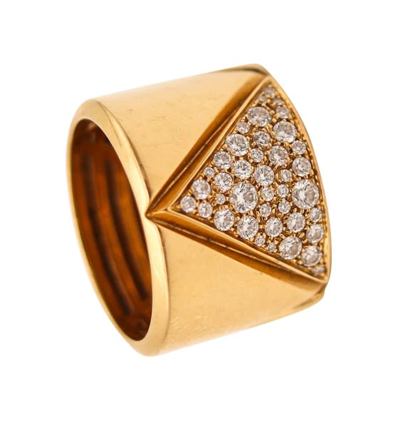 A Triangoli ring designed by Marina B.This geometric sleek band-ring, was created in Milano Italy by: A Triangoli ring designed by Marina B.This geometric sleek band-ring, was created in Milano Italy by the jewelry house of Marina Bvlgari, back in the 1978. The vintage ring is part of the Triangoli co