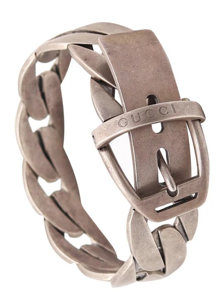 Chained buckle bracelet designed by Gucci.This is an iconic vintage buckle bracelet created in: Chained buckle bracelet designed by Gucci.This is an iconic vintage buckle bracelet created in Florence Italy by the luxury house of Gucci, back in 1990. This buckle bracelet model was crafted in soli