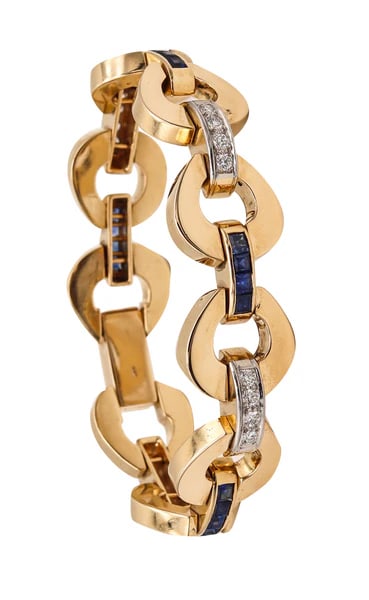 Retro modernist bracelet with gemstones.Beautiful, bold and substantial bracelet crafted during the: Retro modernist bracelet with gemstones.Beautiful, bold and substantial bracelet crafted during the late mid century period back in the 1960. This piece has been made in solid yellow gold of 14 karats