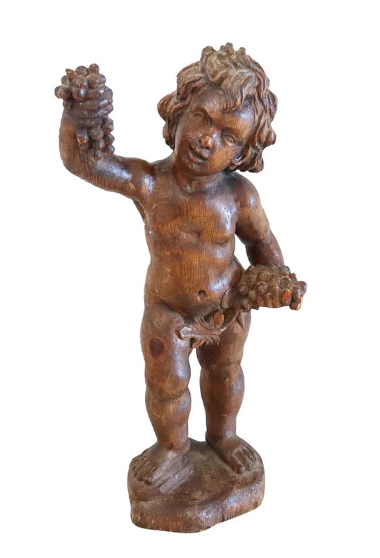 BACCHUS 18th Century German Standing Sculpture of Bacchus In Carved Wood: Standing figure of Bacchus as child holding a bunch of grapesThis is a great antique sculpture of Bacchus as a child created in the northern Europe region, back in the 18th century. Most probably from