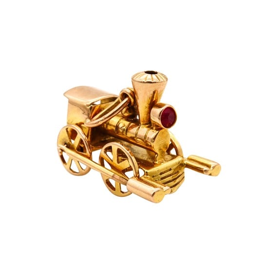 Vintage Locomotive Train Charm Pendant With Movable Mechanical Parts In Solid 18Kt Yellow Gold With: A jeweled charm-pendant in the form of a Locomotive train.Beautiful and highly detailed three-dimensional piece, created during the late art deco and the mid-century periods, circa 1950. This stunning