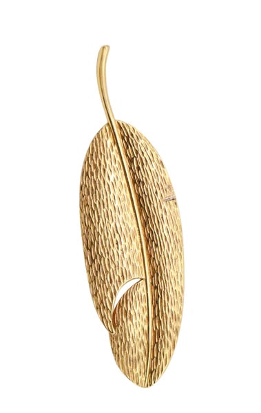 TIFFANY & CO. 1978 Angela Cummings Textured Feather Brooch In 18Kt Yellow Gold: A feather brooch designed by Angela Cummings for Tiffany & Co.This is a very rare brooch created in New York City by Angela Cummings for Tiffany & Co., back in the 1978. The statement brooch has been 