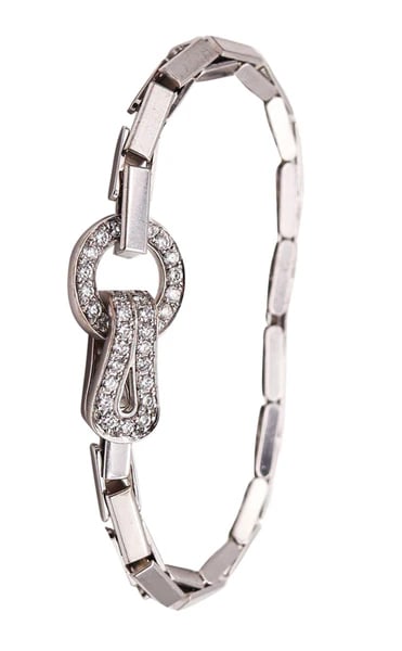 CARTIER Paris Agraph Buckle Bracelet In 18Kt Gold With 1.75 Cwt In VVS Diamonds: Agraph Buckle bracelet with diamonds designed by Cartier.This is a very beautiful Agraph bracelet created in Paris France by the jewelry house of Cartier. This iconic buckle bracelet has been masterfu