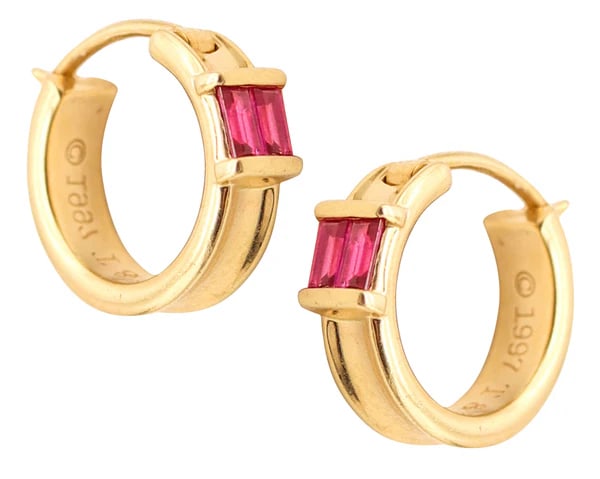 TIFFANY & CO. Hoops Earrings In 18Kt Yellow Gold With Vivid Red Rubies: Hoops earrings with rubies designed by Tiffany & Co.This is a beautiful everyday pair of hoops-earrings created in New York City by the jewelry house of Tiffany & Co. back in 1997. The earrings have b