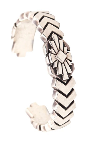 ZUNI 1970 Native American Geometric Bold Cuff In Solid .925 Sterling Silver: A Native American Zuni cuff bracelet.This is a beautiful vintage tribal cuff bracelet created in Arizona by the Zuni Native American culture, back in the 1970. The unusual bold cuff was entirely craft