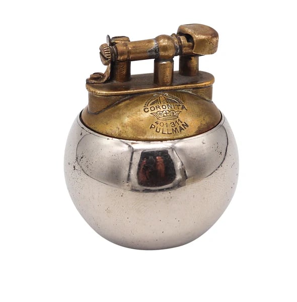 SARASTRO 1925 Pforzheim Deco Coronita Desk Petrol Lighter In Nickel & Brass: A petrol desk-lighter designed by SarastroThis is a beautiful petrol desk lighter created in Pforzheim Germany by the Sarastro Industries Company, back in the late 1925. This lift-arm style lighter is