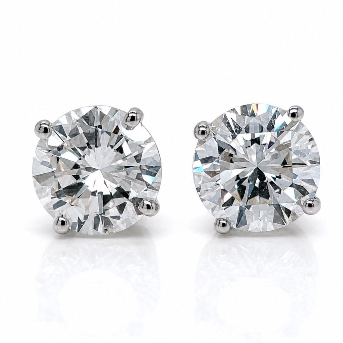 14K White Gold 5.59 Ct. Diamond Stud Earrings: 14K White Gold 5.59 Ct. Diamond Stud EarringsWeighing 3.6 gramsSet with a 3.01 Ct. & 2.58 Ct. DiamondI-J Color, VS2-SI1 Clarity