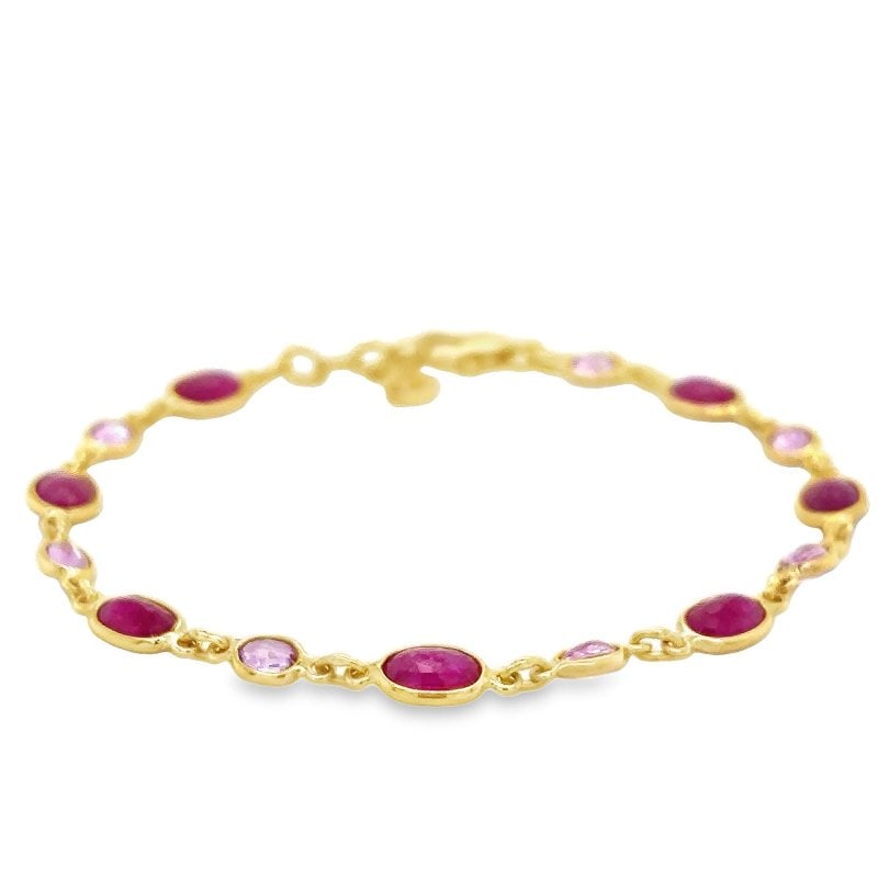 18KT YELLOW GOLD RUBY AND PINK SAPPHIRE STATION BRACELET: 18KT YELLOW GOLD RUBY AND PINK SAPPHIRE STATION BRACELET 7"18KT GOLD WT. APPROX. 2.58 GRAMSTONE WT. APPROX. 4.58 CARAT7" LONG WITH ADJUSTABLE RINGS TILL 6"