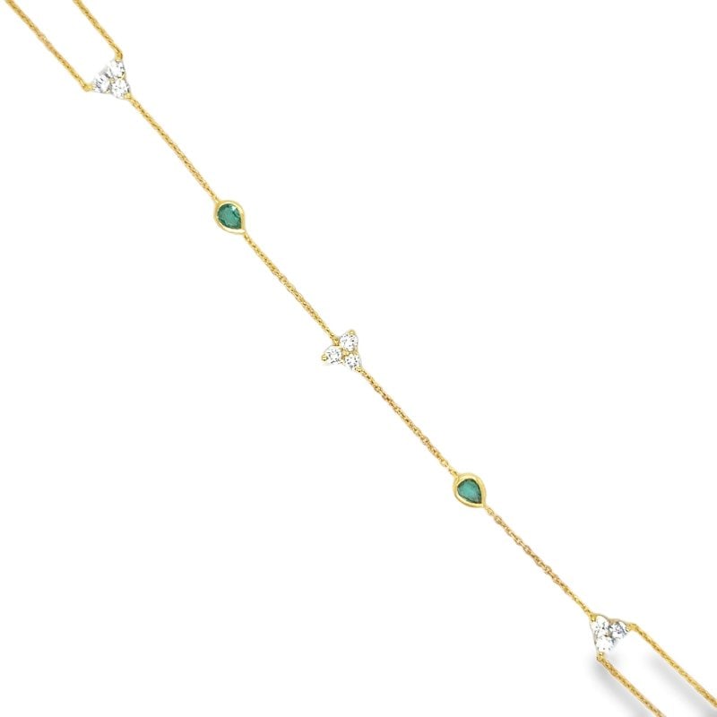 14KT YELLOW GOLD DIAMONDS AND EMERALD HAND CHAIN: 14KT GOLD WT. APPROX. 1.53 GRAMDIAMOND WT. APPROX. 0.34 CARAT/ 09 PCSEMERALD WT. APPROX. 0.25 CARAT/ 02 PCSWRIST TO FINGER LENGTH APPROX. 3.5 INCHES LONGWRIST LENGTH APPROX. 7 INCHES LONG (6.5 INCHES 