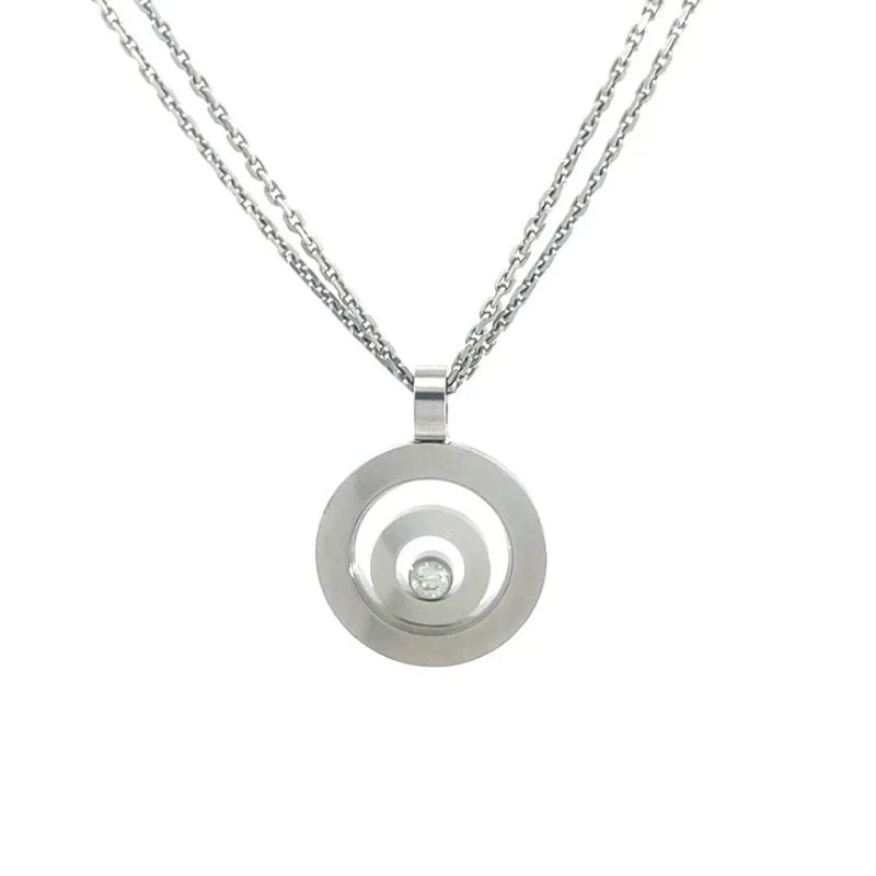 Chopard Happy Spirit Gold Necklace Floating Diamond 18k White Box & Cert.: From the Happy Spirit Collection by Chopard, this 18k white gold concentric circle design defines the hallmark of the Happy Spirit line. The circular frames next inside one another with the single bez
