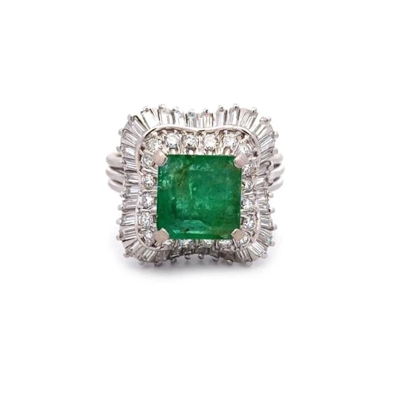 Diamond Emerald Gold Ring 18k White Ballerina Cocktail Style: The product is a vintage 18k white gold ring featuring a square green emerald gemstone with 2 tier below set with natural round and baguette diamonds in a ballerina style. This ring is beautifully cra