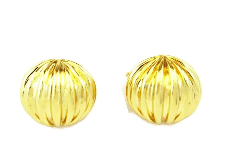Tiffany & Co. Earrings 18k Yellow Gold Fluted Dome Clip-On: The Tiffany & Co. Earrings are crafted with 18k yellow gold, showcasing a fluted dome design in a stud style. These clip-on earrings feature the iconic brand's signature, making them a coveted piece o
