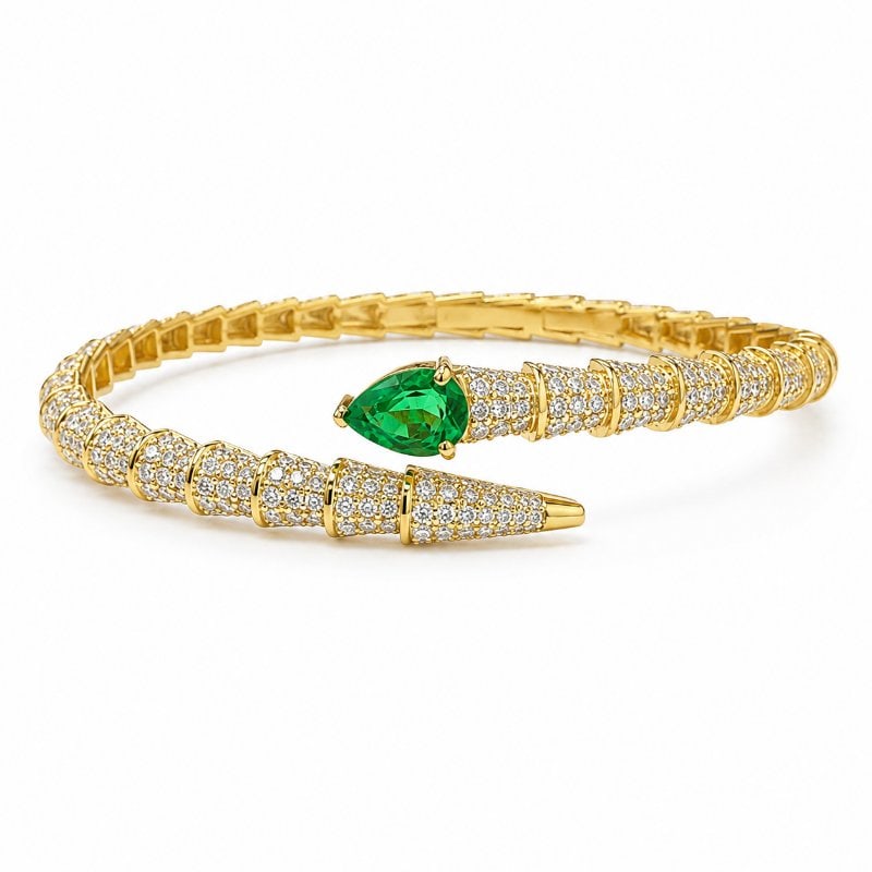 14KT GOLD DIAMOND AND EMERALD BRACELET: 14KT. GOLD WT. APPROX. 13.90 GRAMDIAMOND WT. APPROX. 3.43 CT/ 558 PCSEMERALD WT. APPROX. 0.69 CT/ 1 PCSSIZE:APPROX: 54 X 44 MM