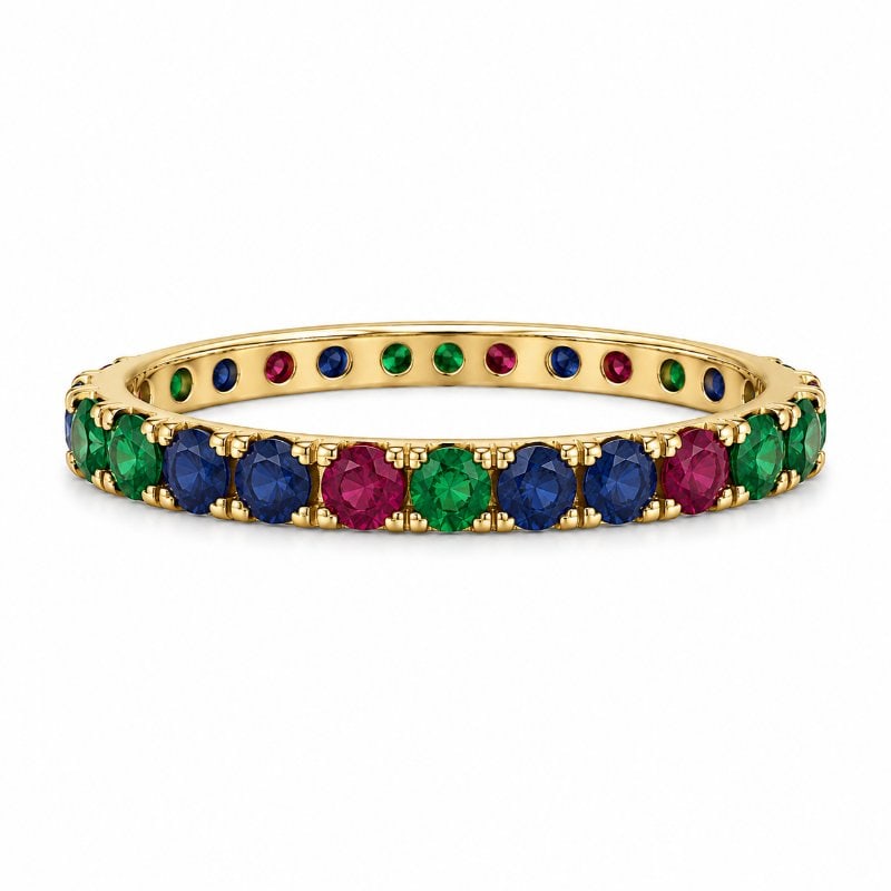 18KT YELLOW GOLD EMERALD, BLUE SAPPHIRE AND RUBY ETERNITY RING: 18KT GOLD WT. APPROX. 1.00 GRAMEMERALD, BLUE SAPPHIRE AND RUBY WT. APPROX. 0.30 CARAT Size: 7RANDOMIZED STONE ORDER