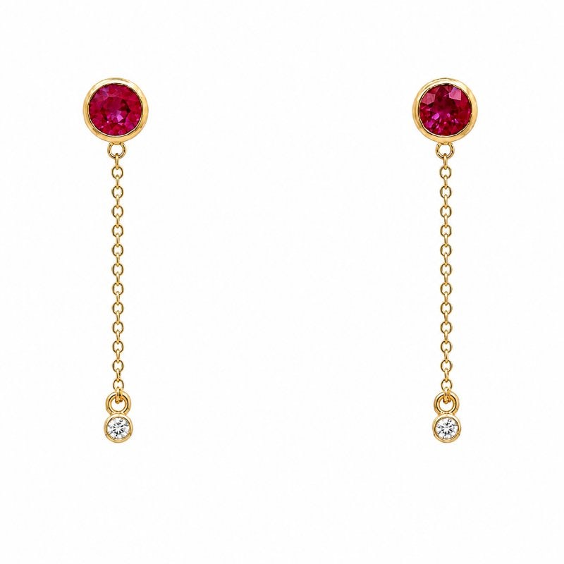 14KT YELLOW GOLD RUBY ROUND SHAPE EARRING: 14KT YELLOW GOLD RUBY ROUND SHAPE AND DIAMOND EARRING14KT GOLD WT. APPROX. 1.33 GRAMDIAMOND WT. APPROX. 0.08 CARATRUBY WT. APPROX. 1.02 CARAT