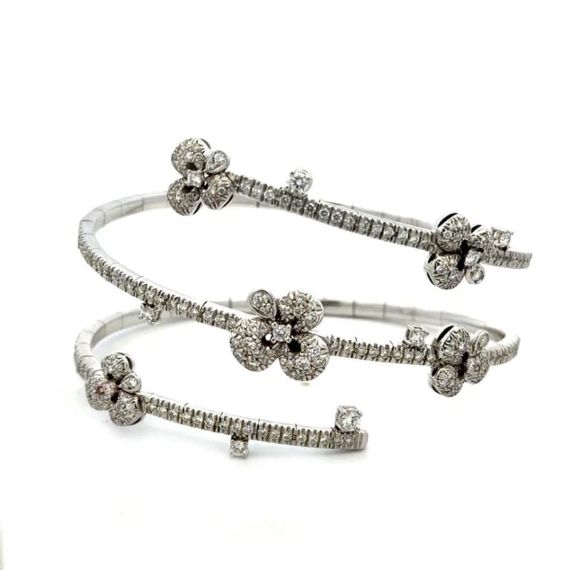 Diamond Gold Wrap Bracelet 18k White Floral Motifs Flex Signed Miseno Italy: This gorgeous natural diamond gold bracelet is by Miseno Fine Jewelry in Italy. It is a stunning piece, featuring a triple wrap flex band in 18k white gold and the front half has band has prong set di