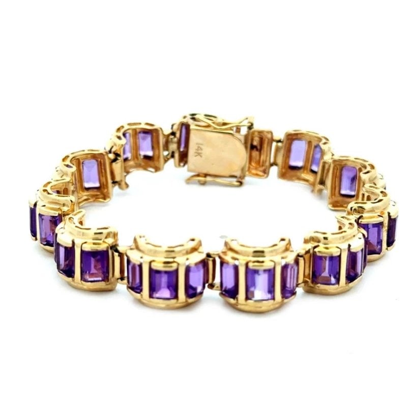 Amethyst Gold Bracelet 14k Yellow Emerald Cut Curved Tank Link Style: The Amethyst Gold Bracelet is a stunning piece of vintage jewelry featuring a unique curved link style, horizontally oriented in 14k yellow gold. With vibrant purple amethyst held within thick, blocky
