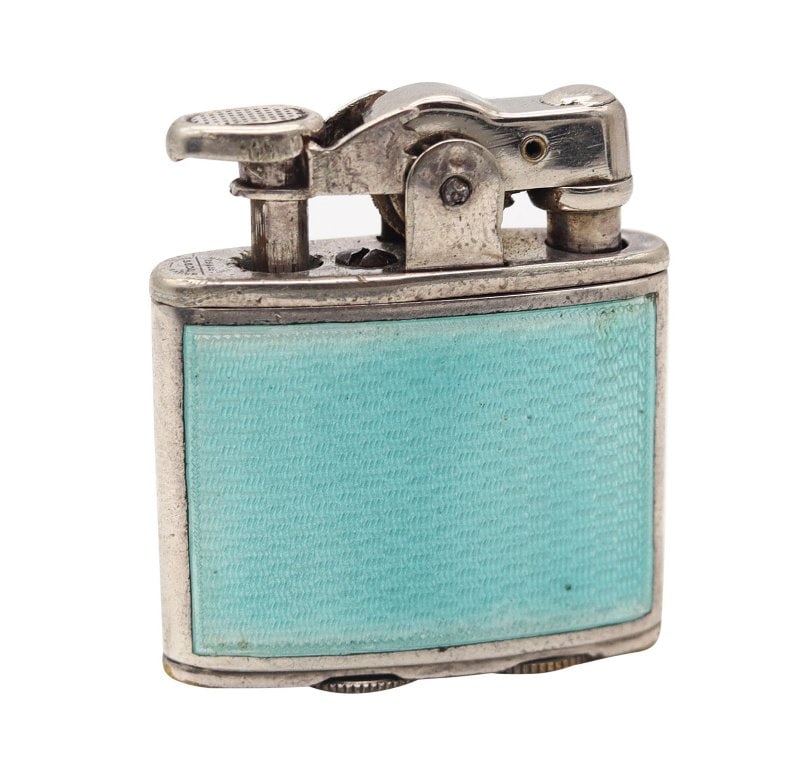 RONSON 1928 First Model Enameled Junior Petrol Lighter In .925 Sterling Silver: Enameled Junior petrol lighter designed by Ronson.This a very rare antique pocket petrol lighter created in New Jersey United States by The Ronson Art Metal Work Co. during the art deco period, back i