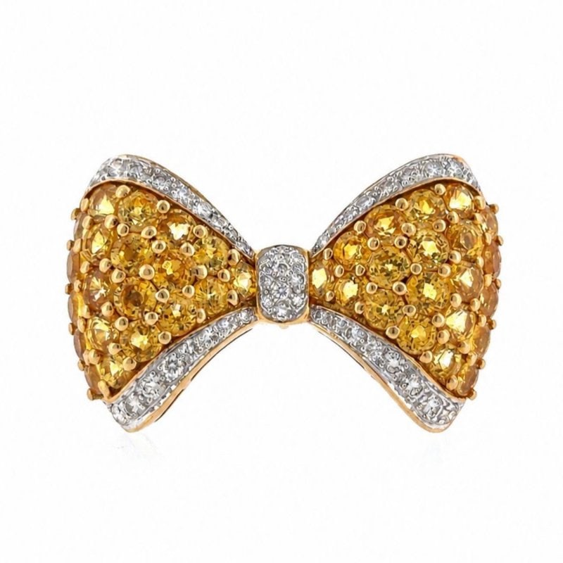 18K Yellow Gold Yellow Sapphire & Diamond Ribbon Brooch: 18K Yellow Gold Yellow Sapphire & Diamond Ribbon Brooch Weighing 12.7 gramsSet with 44 Diamonds weighing app. 1.00 Ct. G-H Color, VVS-VS ClarityAlong with 40 Yellow Sapphires weighing app. 6.00 Ct.1.5