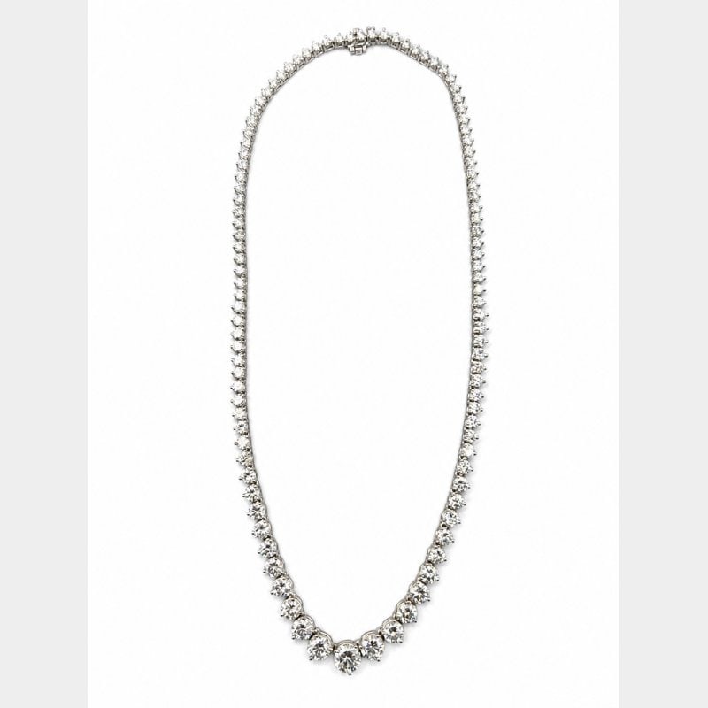 14K White Gold GIA Certified Graduated Diamond Necklace: 14K White Gold GIA Certified Graduated Diamond Necklace Weighing 28.2 gramsSet with a GIA Certified 1.41 Ct. Diamond I Color, SI2 Clarity 7.28 – 7.31 x 4.35mm GIA #1242018254Along with 104 Diamonds